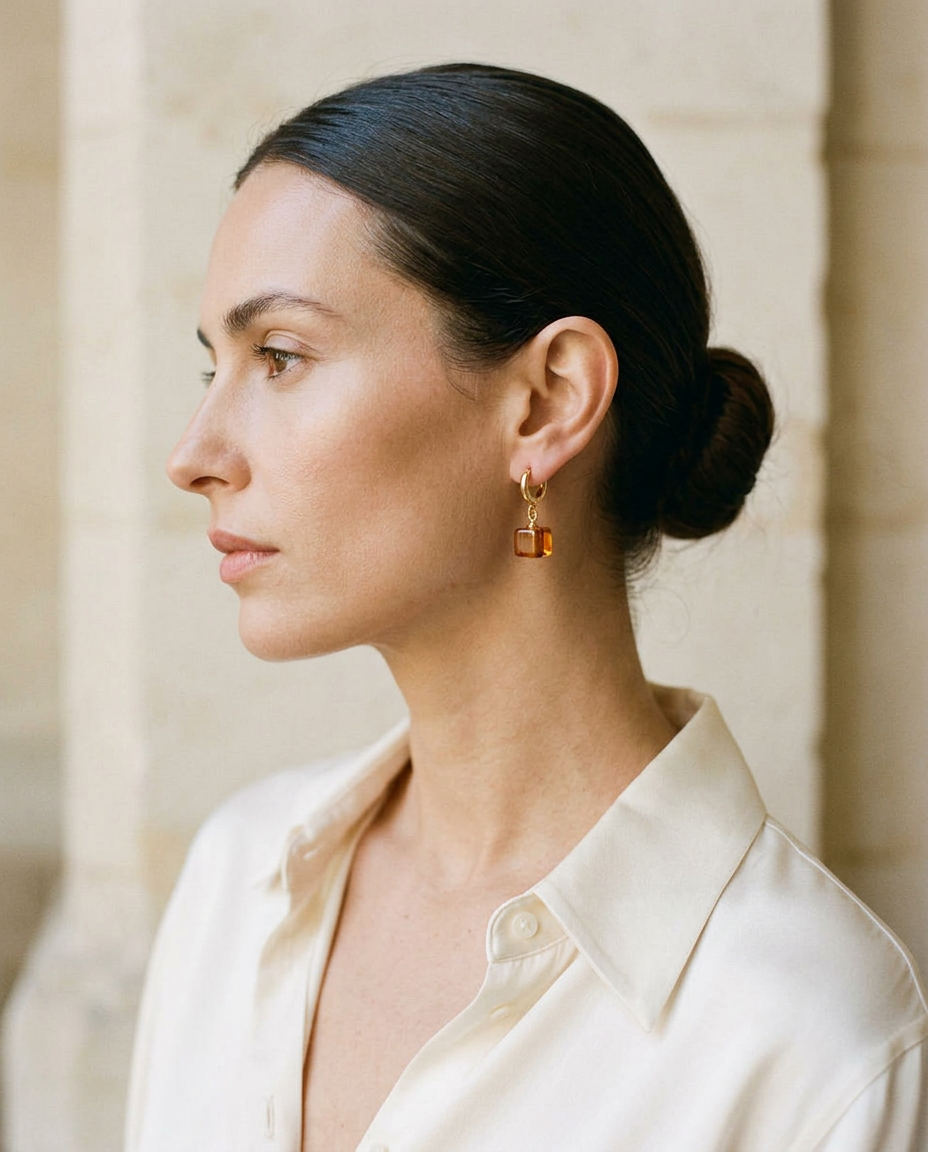 Model wearing AMBREA cognac amber cube drop earrings